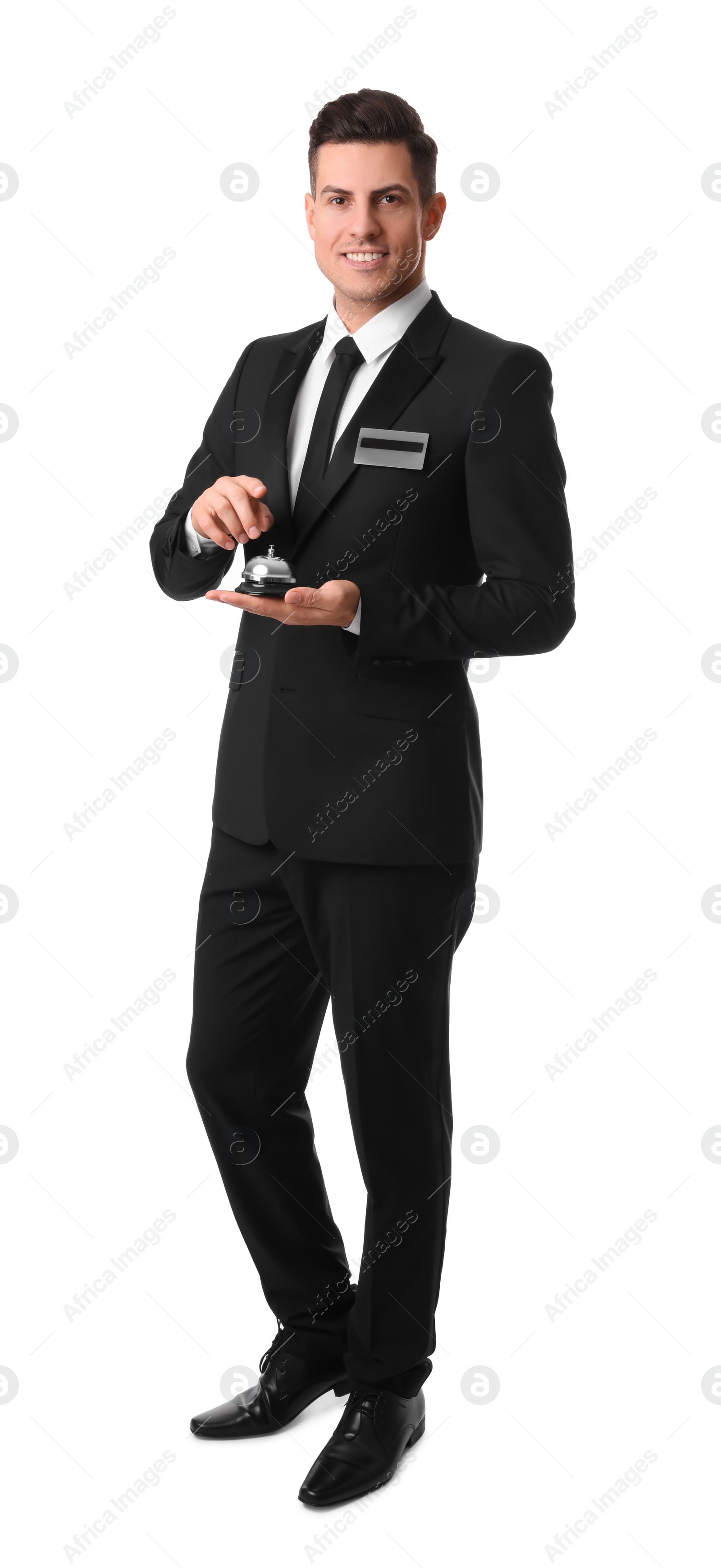 Photo of Happy receptionist in uniform holding service bell on white background