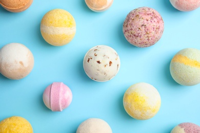 Photo of Flat lay composition with bath bombs on color background