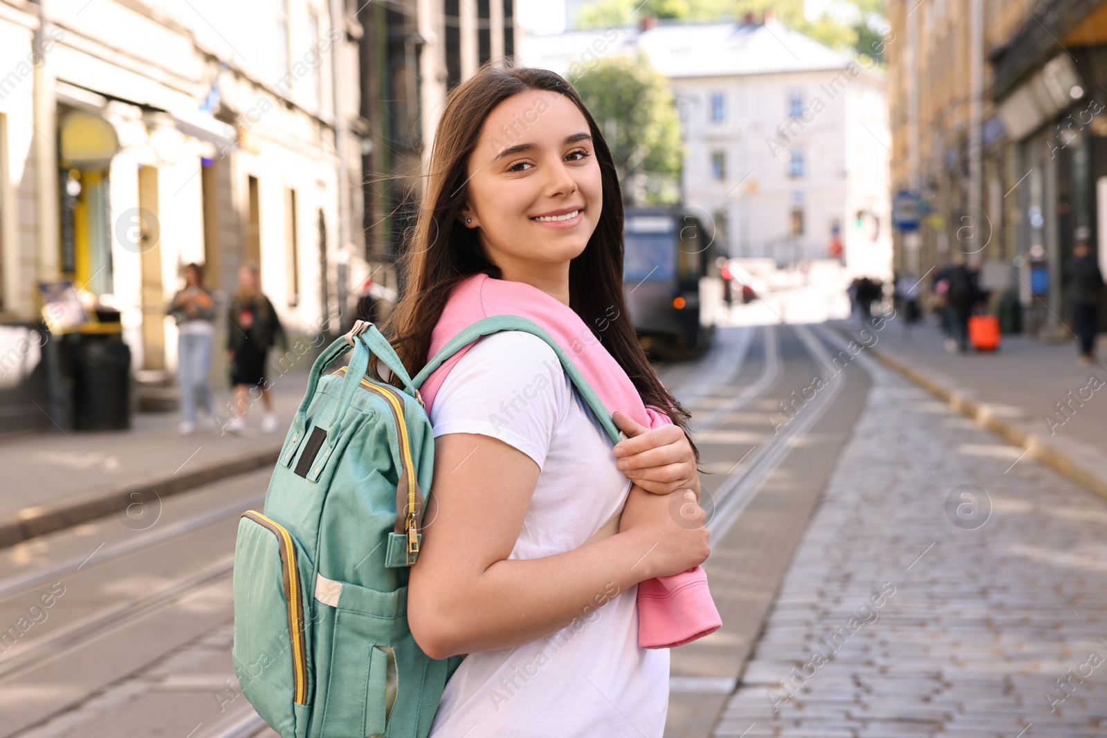 Photo of Travel blogger recording video on city street