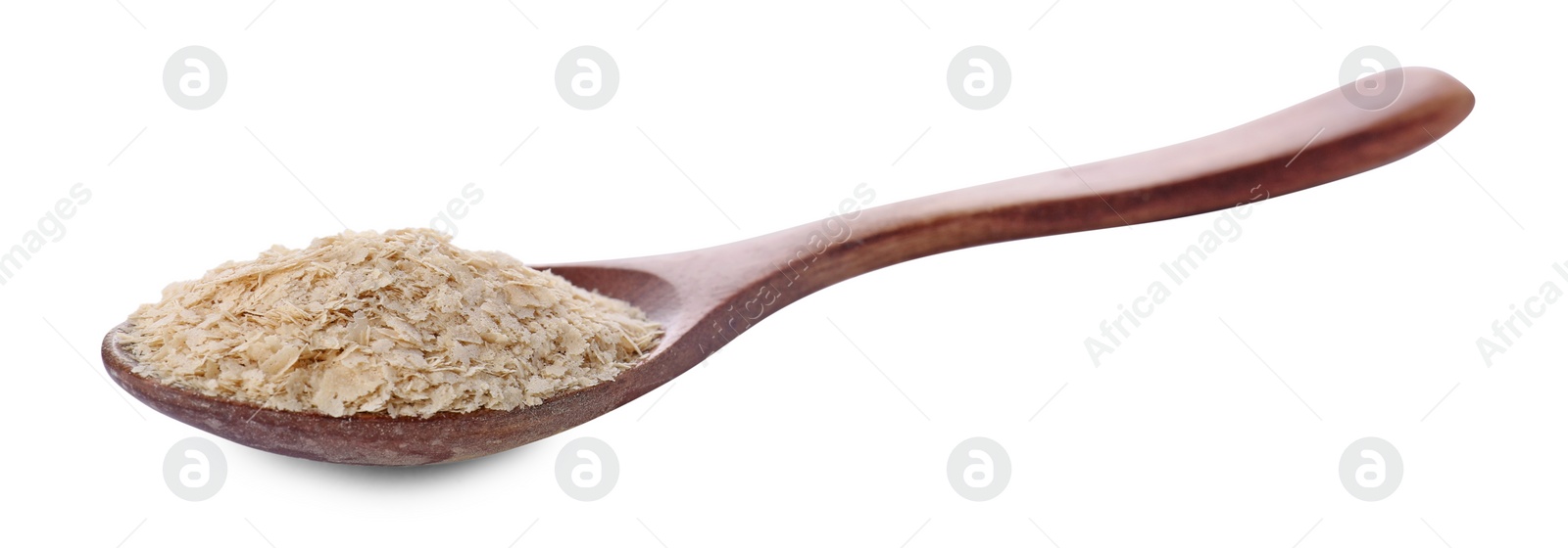 Photo of Brewer's yeast flakes in spoon isolated on white