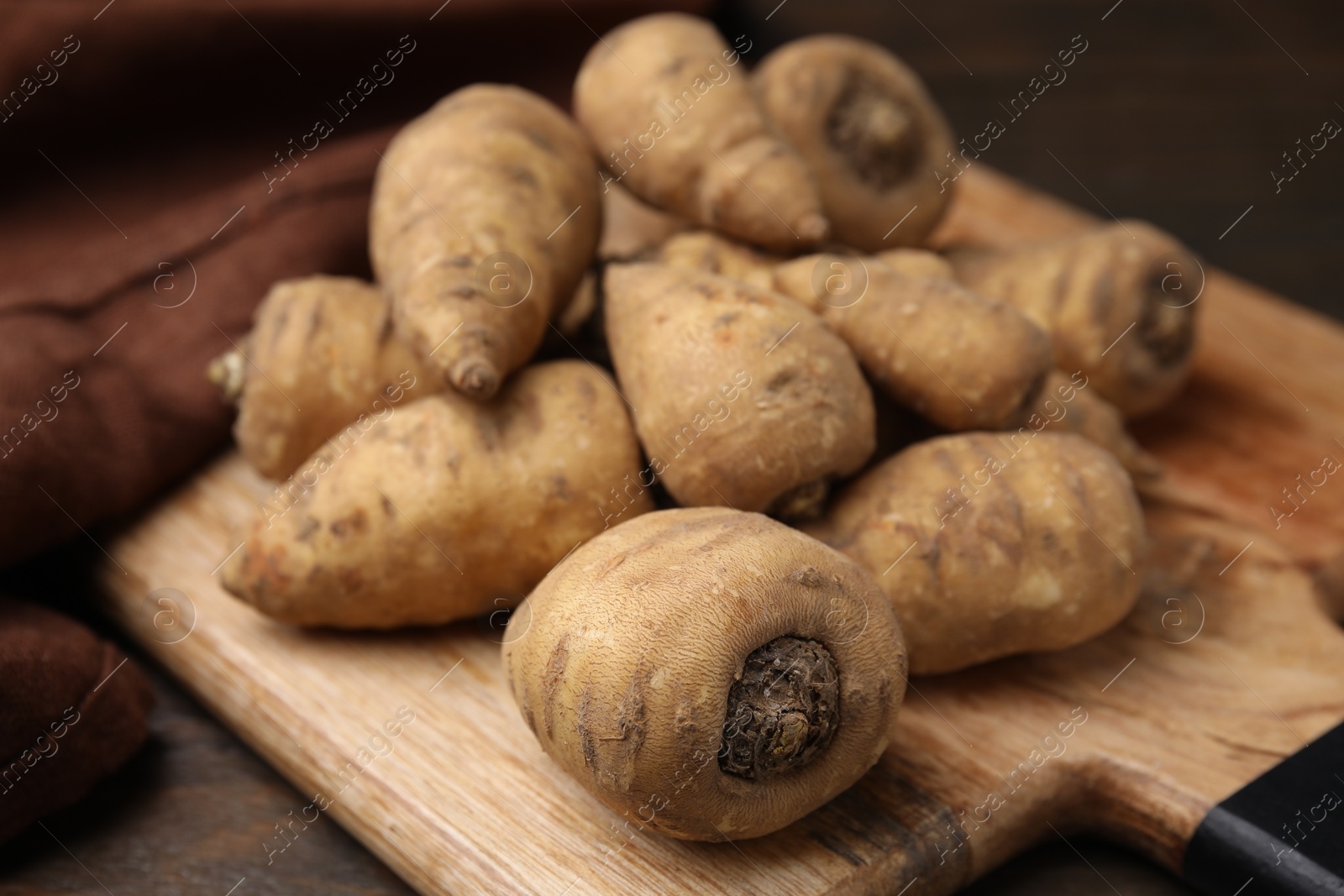 Photo of Tubers of turnip rooted chervil on table, closeup