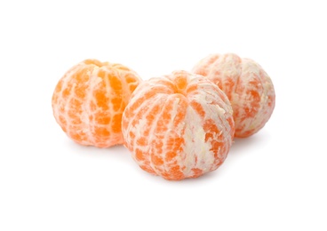 Photo of Peeled fresh tangerines on white background. Citrus fruit