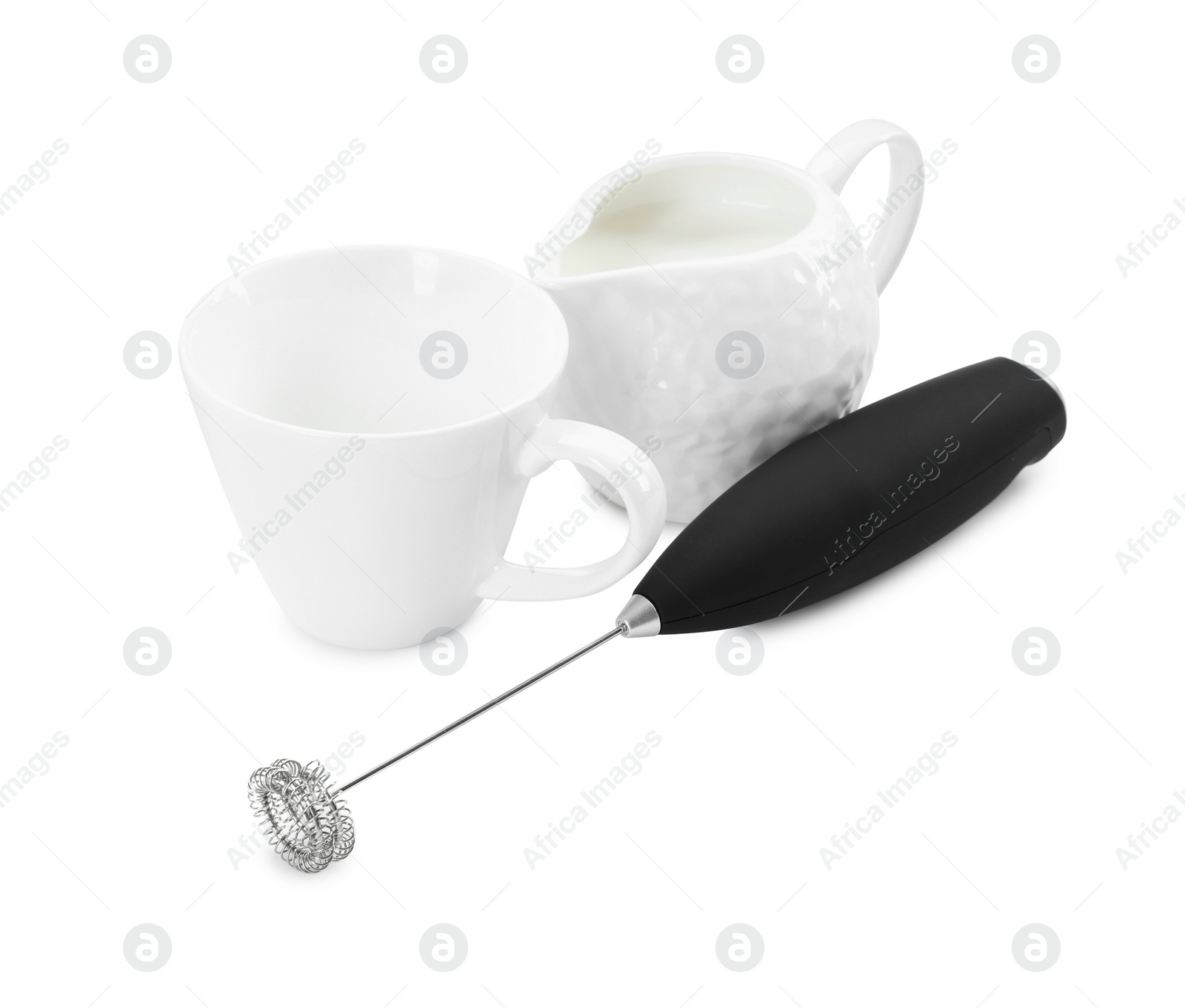 Photo of Milk frother wand, cup and pitcher isolated on white