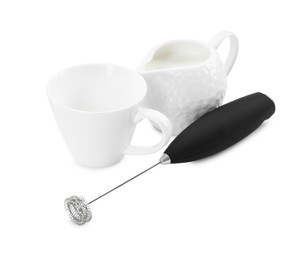 Photo of Milk frother wand, cup and pitcher isolated on white