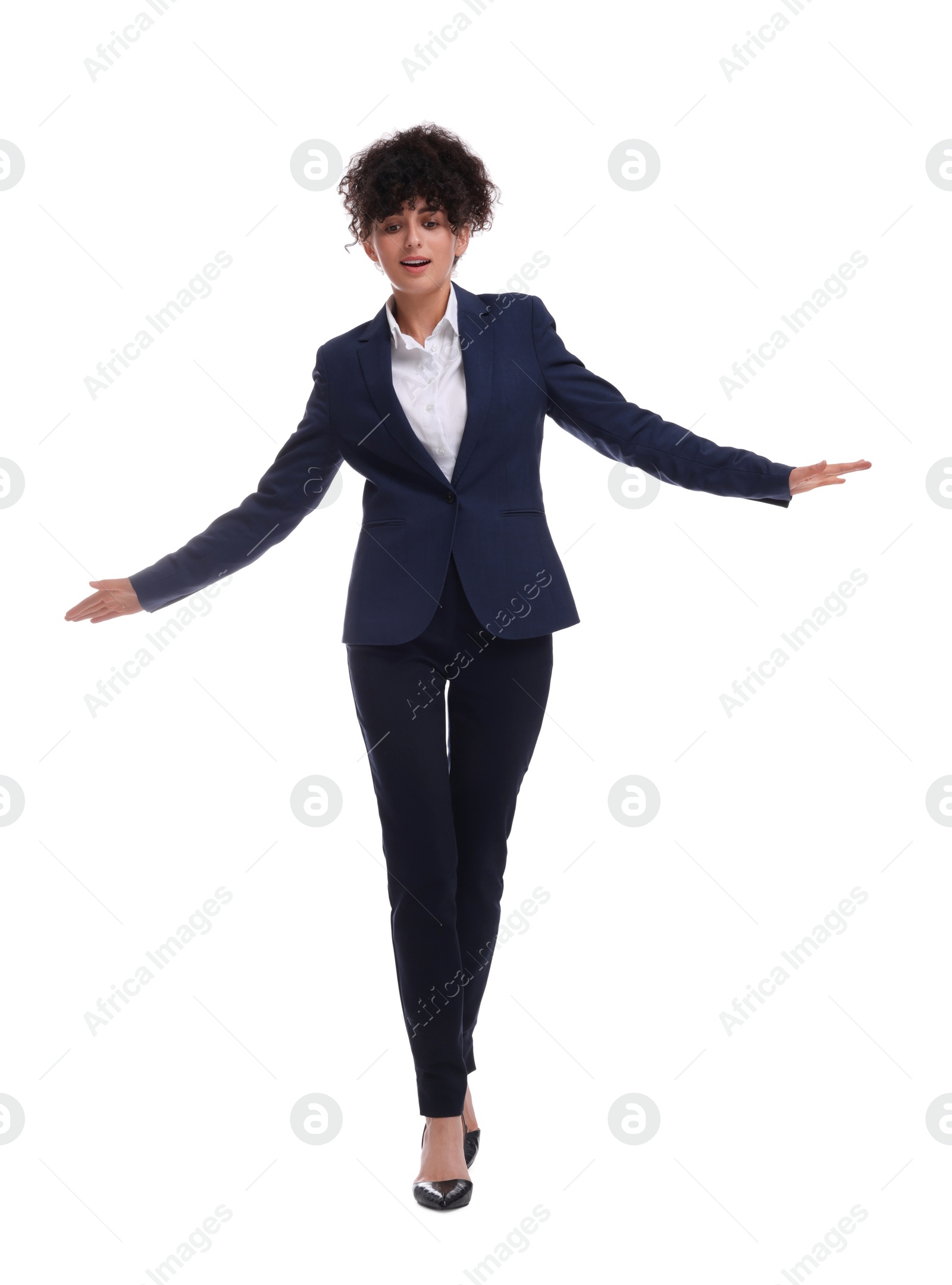 Photo of Beautiful businesswoman in suit walking on white background