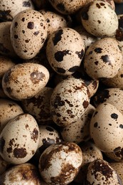 Photo of Many fresh quail eggs as background, closeup