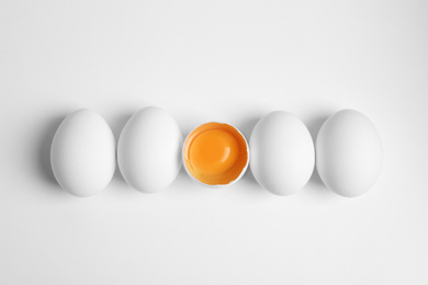 Photo of Fresh raw chicken eggs on white background, flat lay