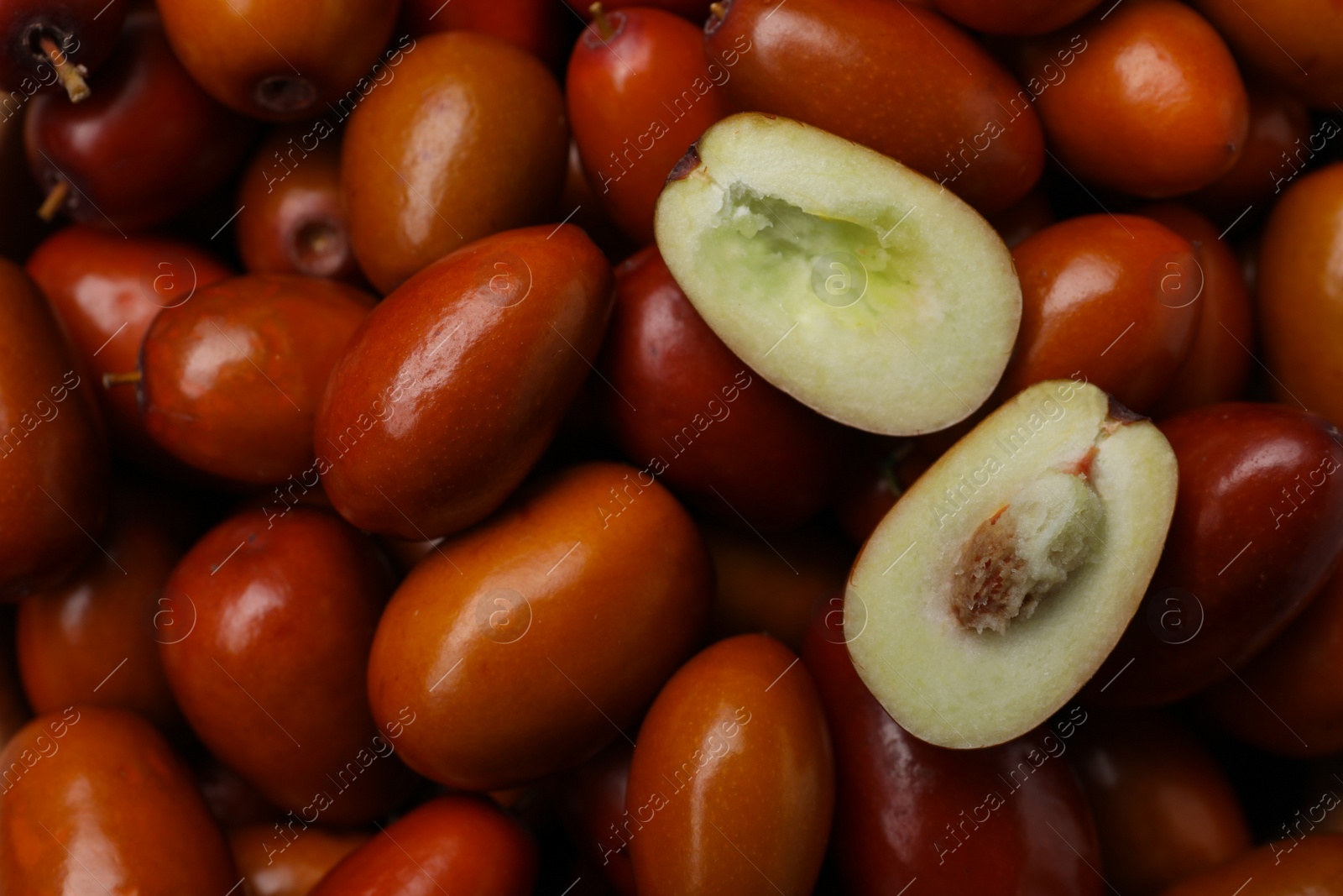 Photo of Closeup view of fresh Ziziphus jujuba fruits as background