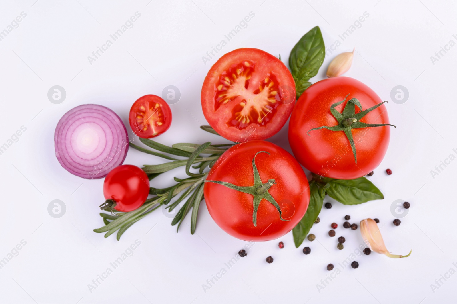 Photo of Flat lay composition with different whole and cut tomatoes on white background