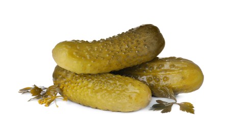Photo of Crunchy pickled cucumbers and parsley on white background