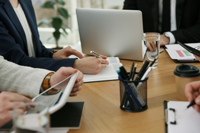 Businesspeople having meeting in office, closeup. Management consulting
