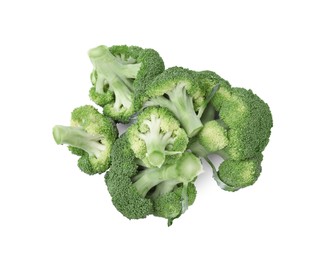 Pile of fresh raw green broccoli isolated on white, top view