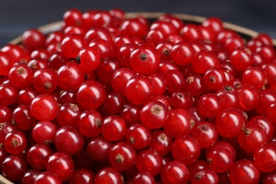 Many ripe red currants in bowl, closeup