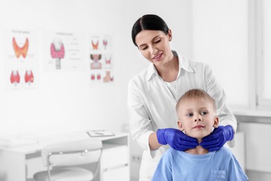 Photo of Endocrinologist examining boy's thyroid gland at hospital, space for text