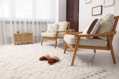 Photo of Stylish living room with soft white carpet and furniture. Interior design