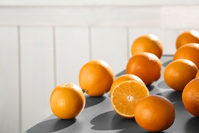 Photo of Fresh juicy oranges on table, space for text. Healthy fruits