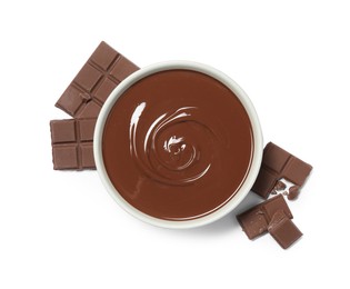 Photo of Milk chocolate paste in bowl and pieces isolated on white, top view