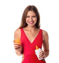 Woman with bottle of sun protection body cream on white background