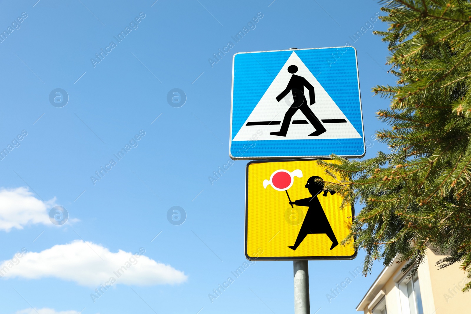 Photo of Different traffic signs on city street, space for text