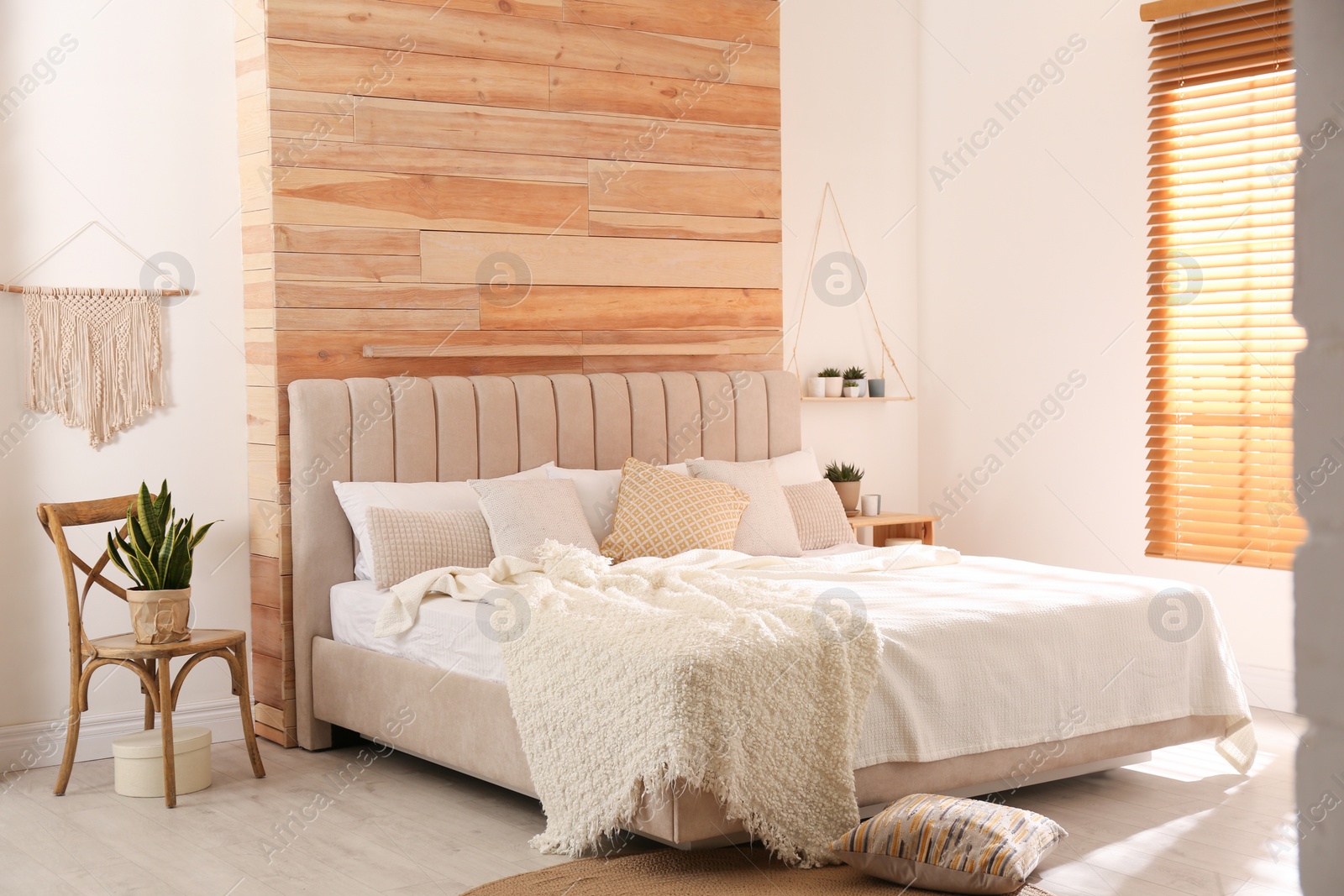 Photo of Stylish room interior with big comfortable bed