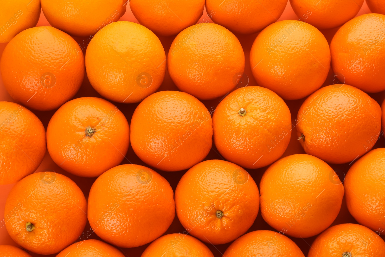 Photo of Fresh ripe oranges as background, top view