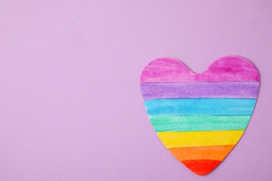 Photo of Top view of rainbow heart on color background, space for text. Gay symbol