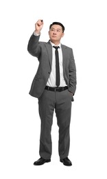 Businessman with marker writing on white background