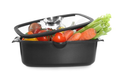 Photo of Fresh products in black pot and glass lid isolated on white