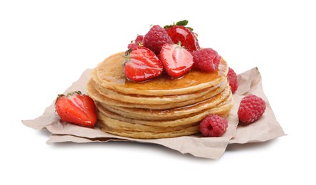 Tasty pancakes with fresh berries and honey on white background