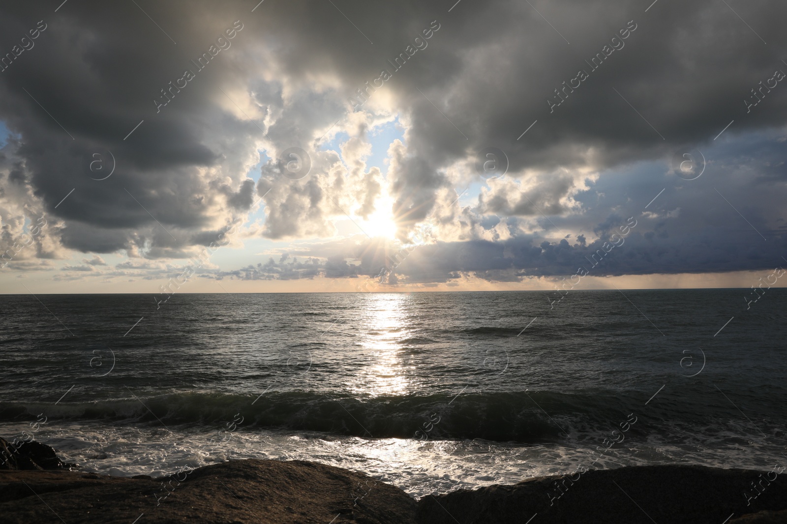 Photo of Picturesque view of sky with heavy rainy clouds over sea