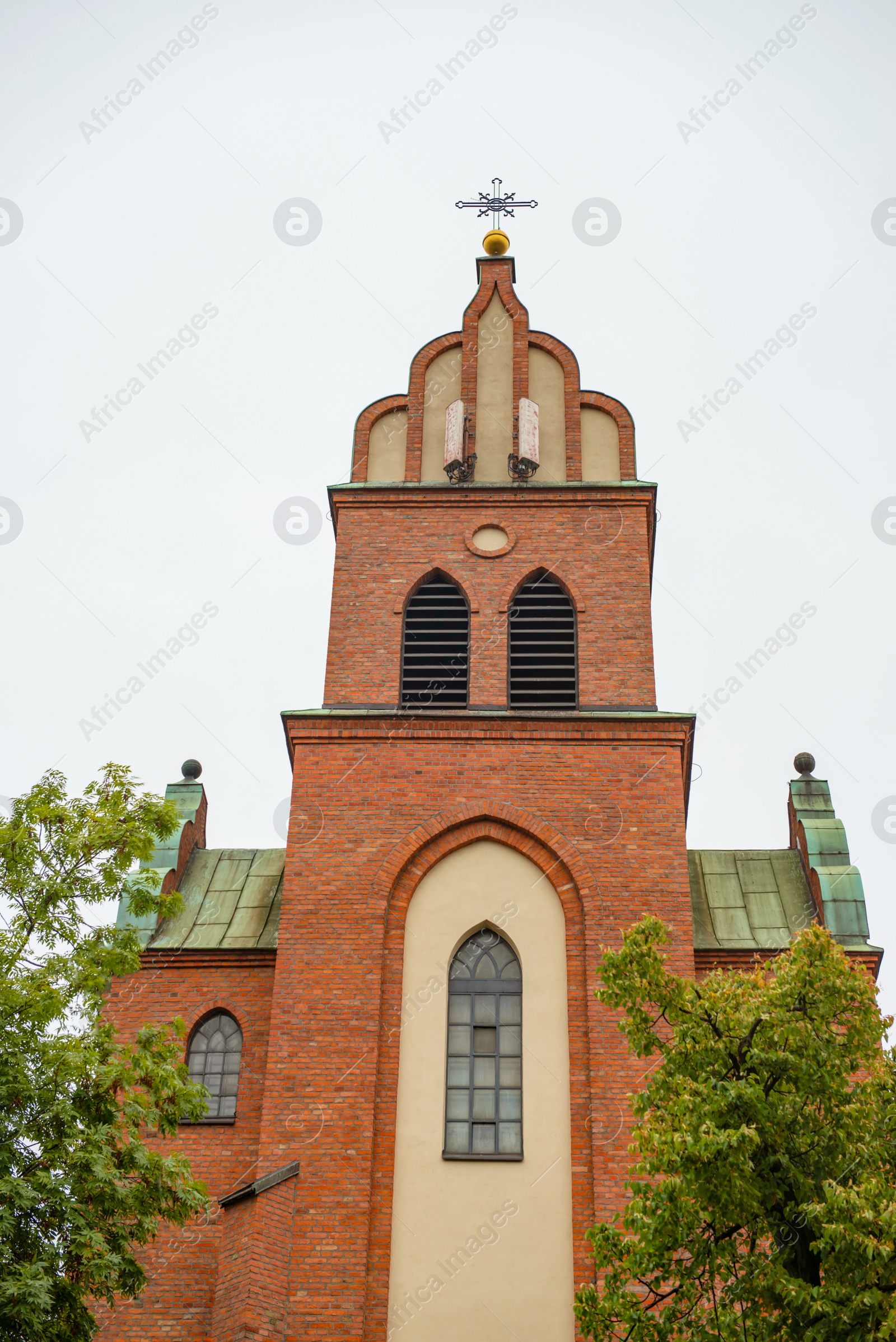 Photo of Beautiful view of church and plants under sky outdoors
