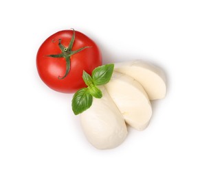 Photo of Delicious mozzarella cheese, tomato and basil leaves isolated on white, top view. Cooking Caprese salad