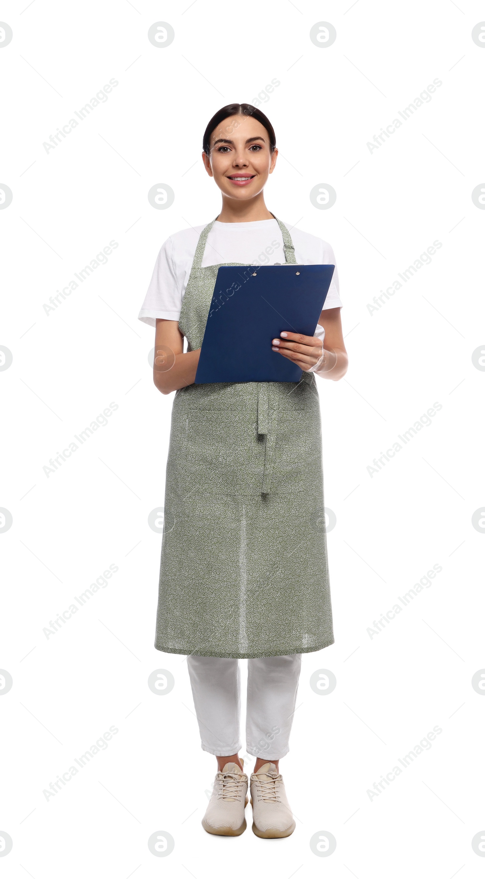 Photo of Young woman in light green apron with clipboard on white background