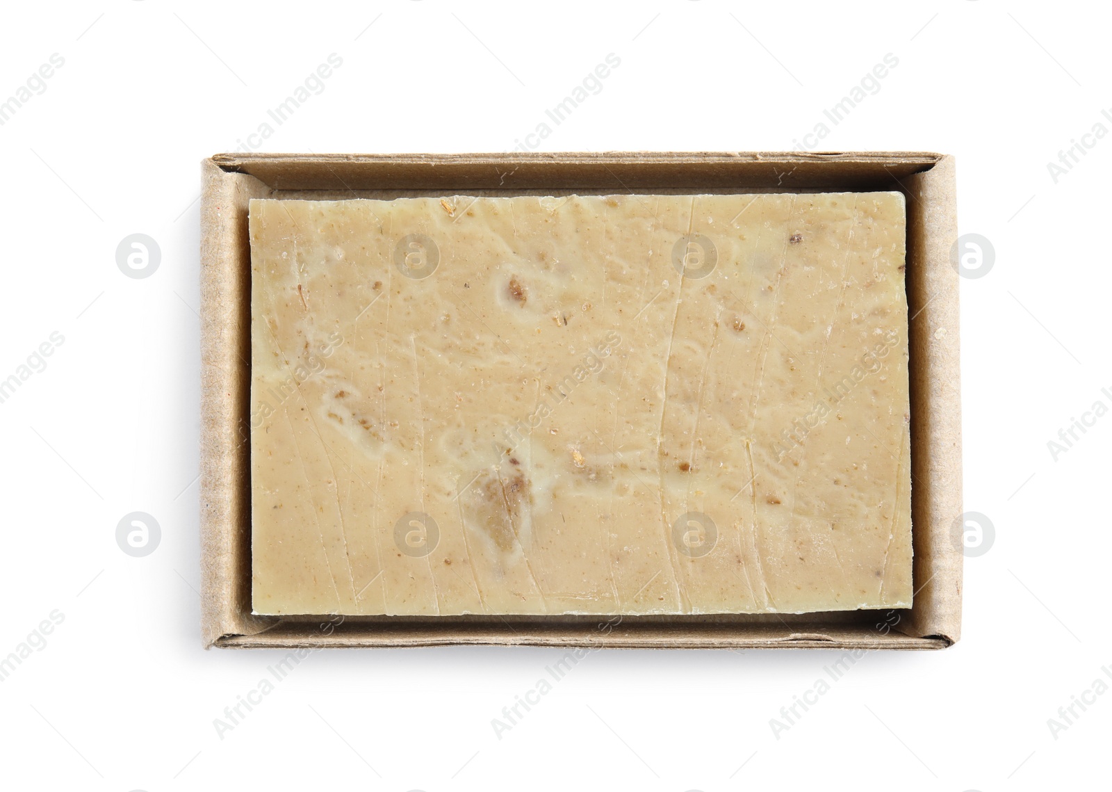 Photo of Hand made soap bar in cardboard package on white background, top view