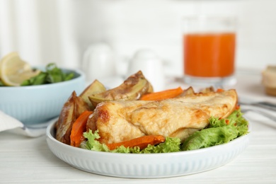 Photo of Delicious cooked chicken and vegetables on white wooden table, closeup. Healthy meals from air fryer