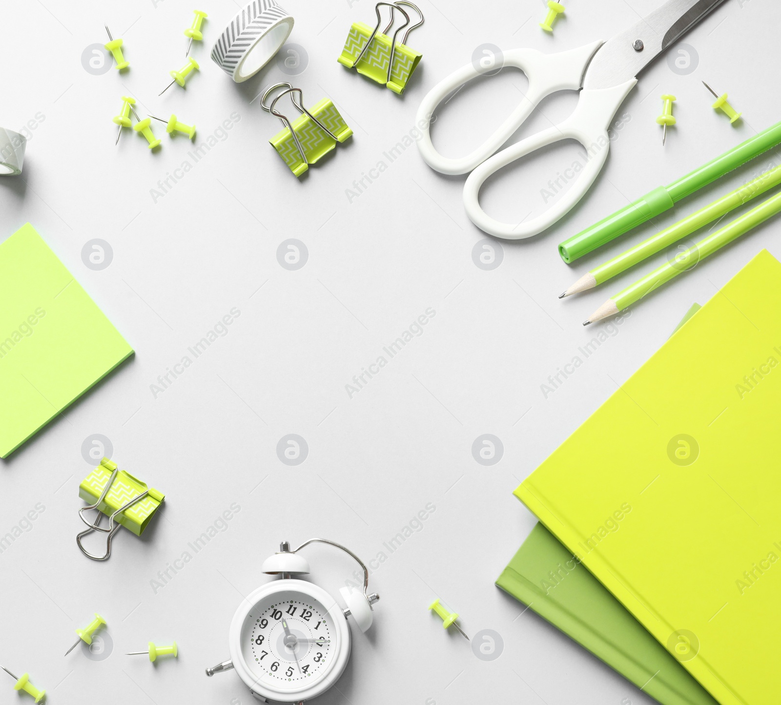 Photo of Flat lay composition with scissors and office supplies on grey background. Space for text