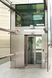 Photo of Modern large and silver inclusive elevator on street