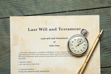 Photo of Last Will and Testament, pocket watch and pen on rustic wooden table, top view