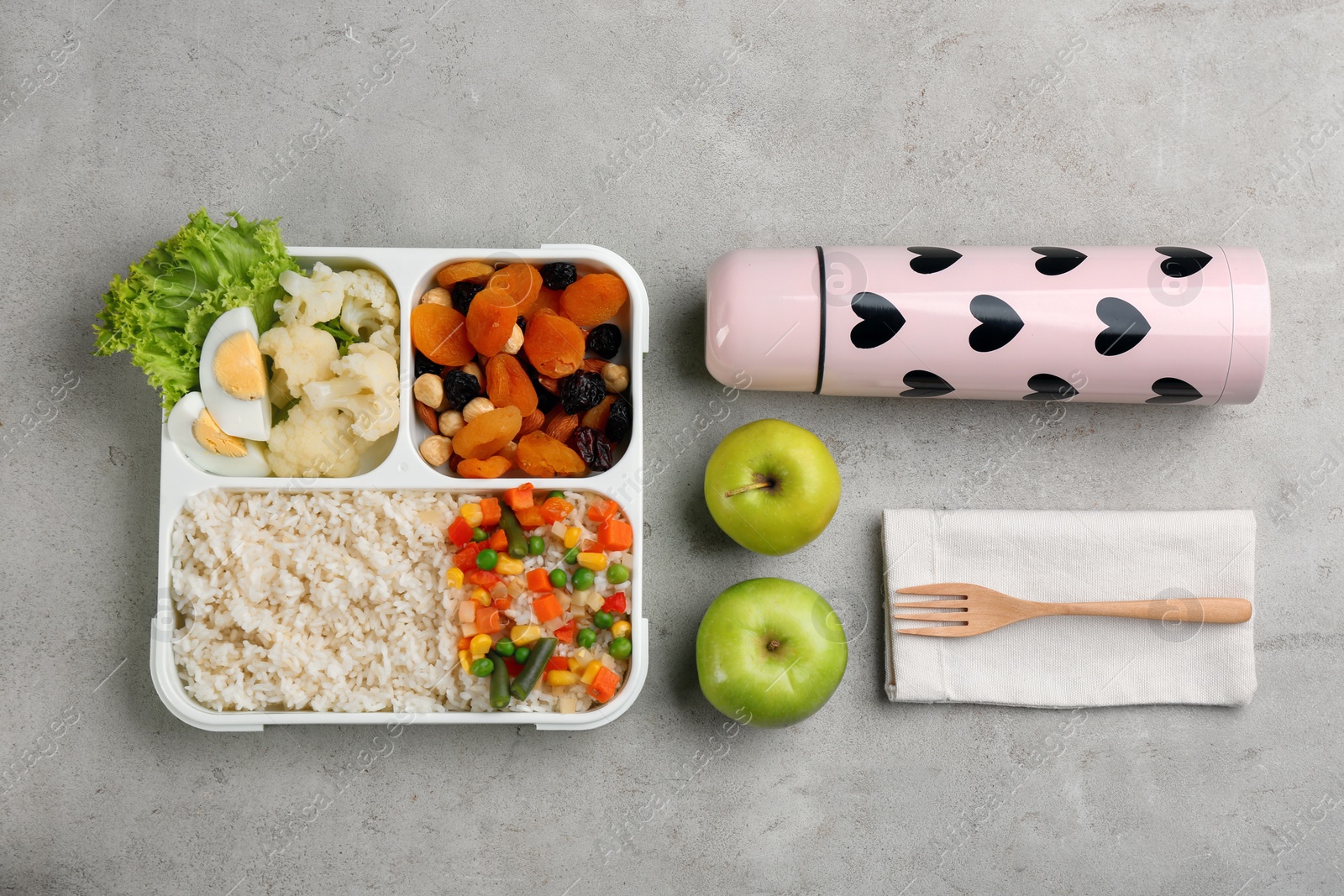 Photo of Flat lay composition with thermos and food on light grey table