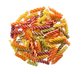 Uncooked fusilli pasta on white background, top view