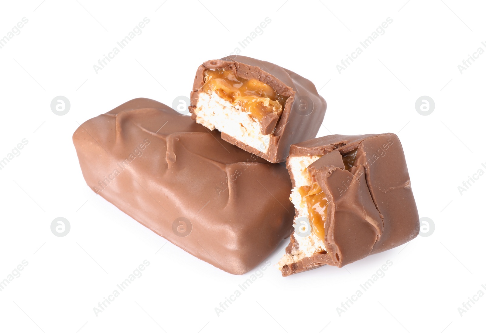 Photo of Pieces of tasty chocolate bars with nougat on white background