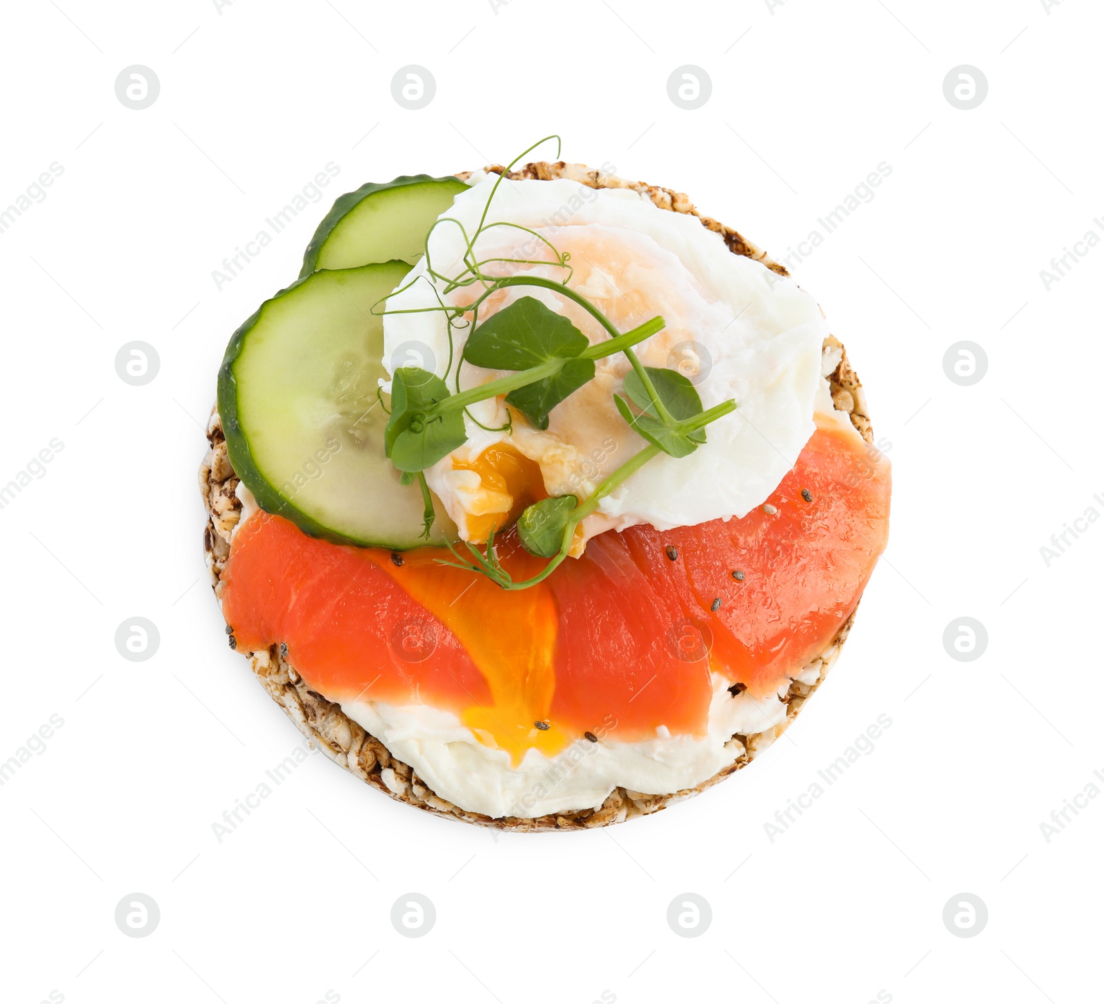 Photo of Crunchy buckwheat cake with salmon, poached egg and cucumber slices isolated on white