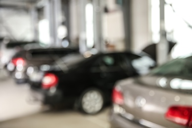 Photo of Blurred view of modern automobile repair shop