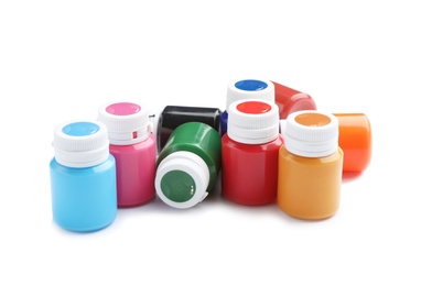 Photo of Jars with colorful paints on white background. Artistic equipment for children