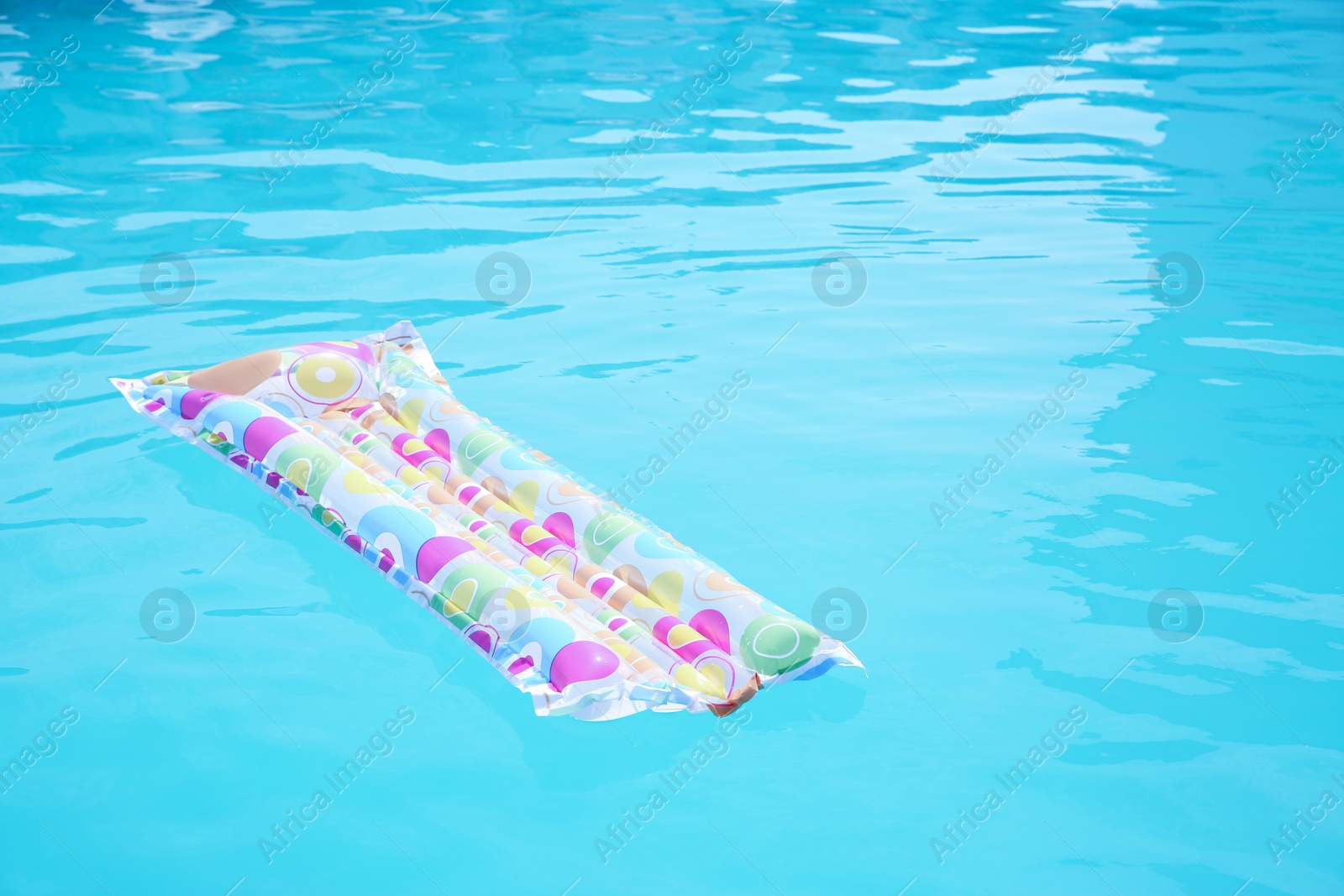 Photo of Inflatable mattress in swimming pool on sunny day