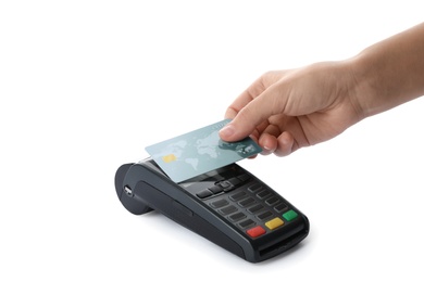 Woman using terminal for contactless payment with credit card on white background