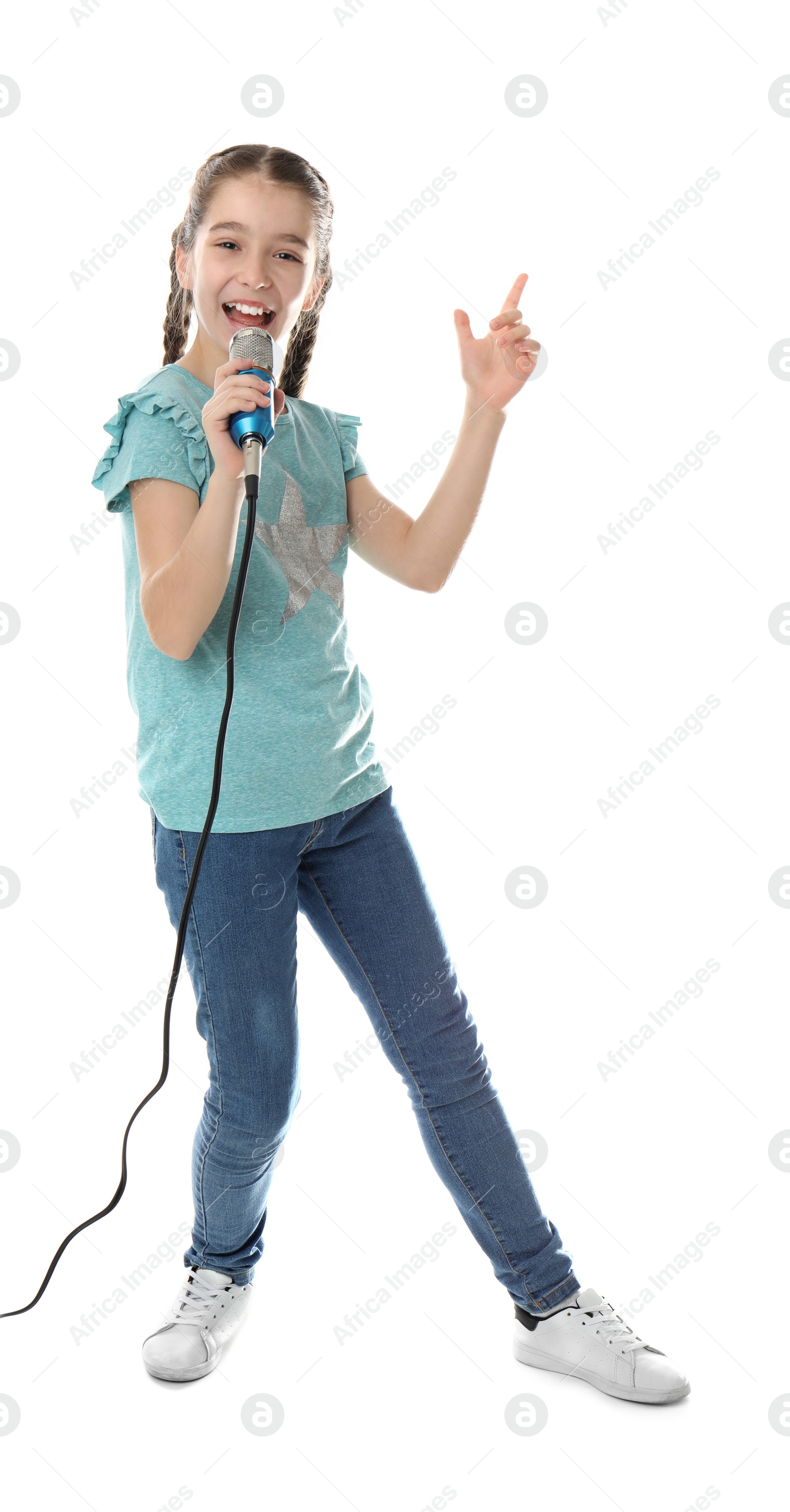 Photo of Cute girl singing in microphone on white background