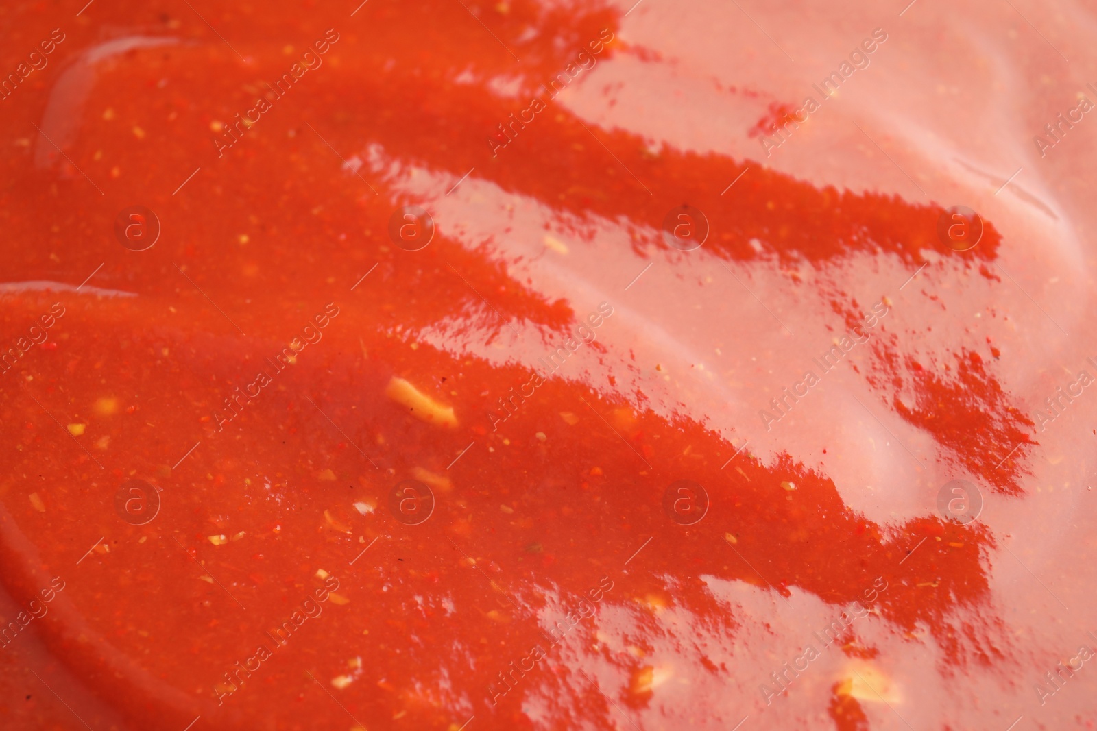 Photo of Fresh tasty tomato sauce as background, closeup