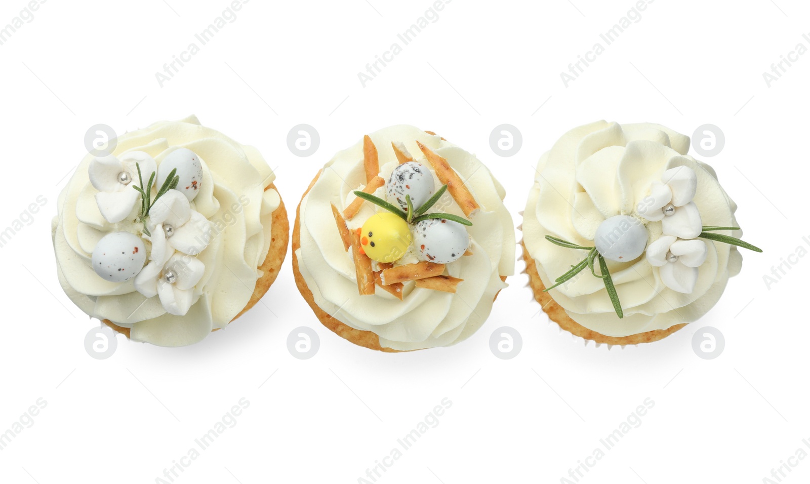 Photo of Tasty Easter cupcakes with vanilla cream isolated on white, top view