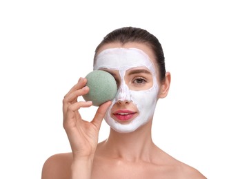 Happy young woman with face mask and sponge on white background